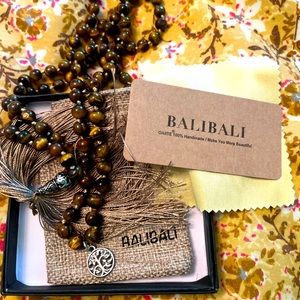 108 Tiger Eye Mala beads in bold and black for protection & strength.